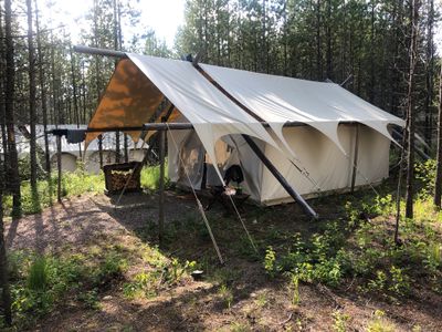 large tent in the woods