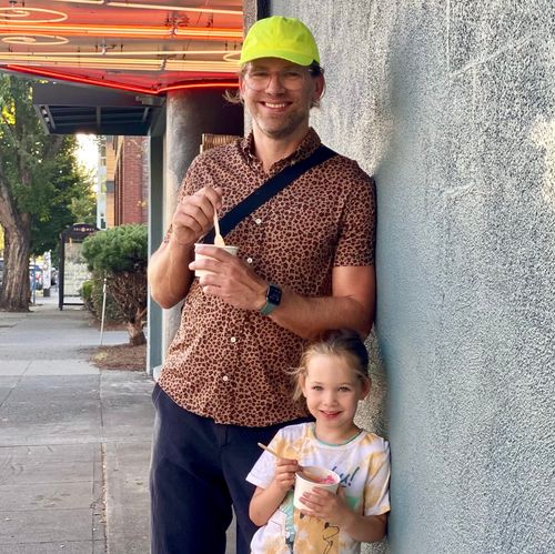 Mark and his daughter enjoying ice cream.